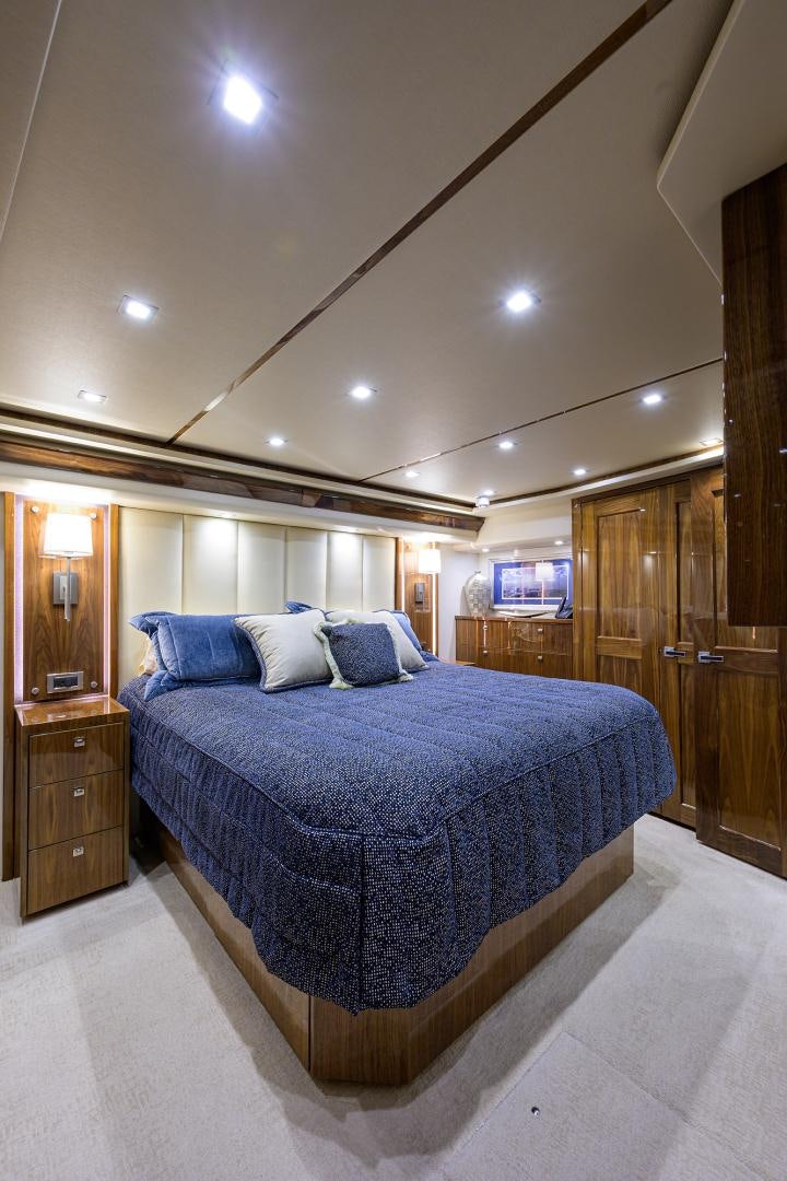 a large bedroom with a large bed aboard Renegade Yacht for Sale