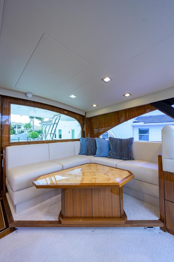 a living room with a couch and a table aboard Renegade Yacht for Sale