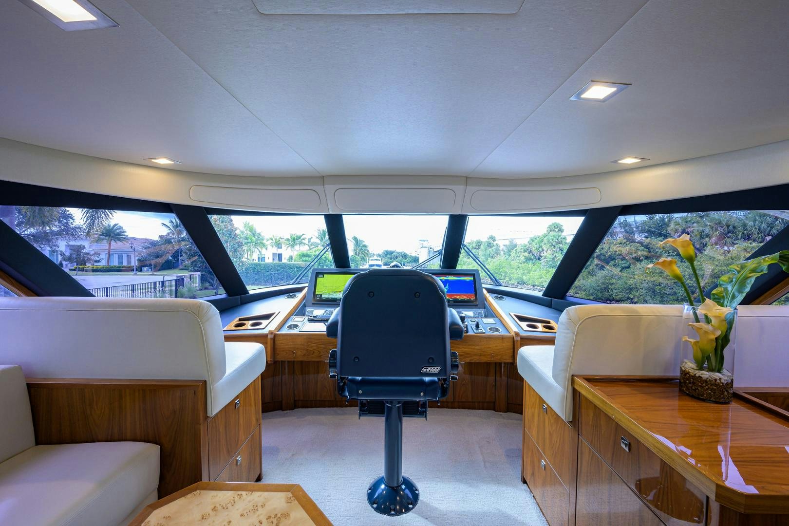 a room with a desk and chairs aboard Renegade Yacht for Sale