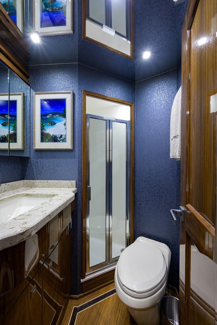 a bathroom with a toilet and a sink aboard Renegade Yacht for Sale