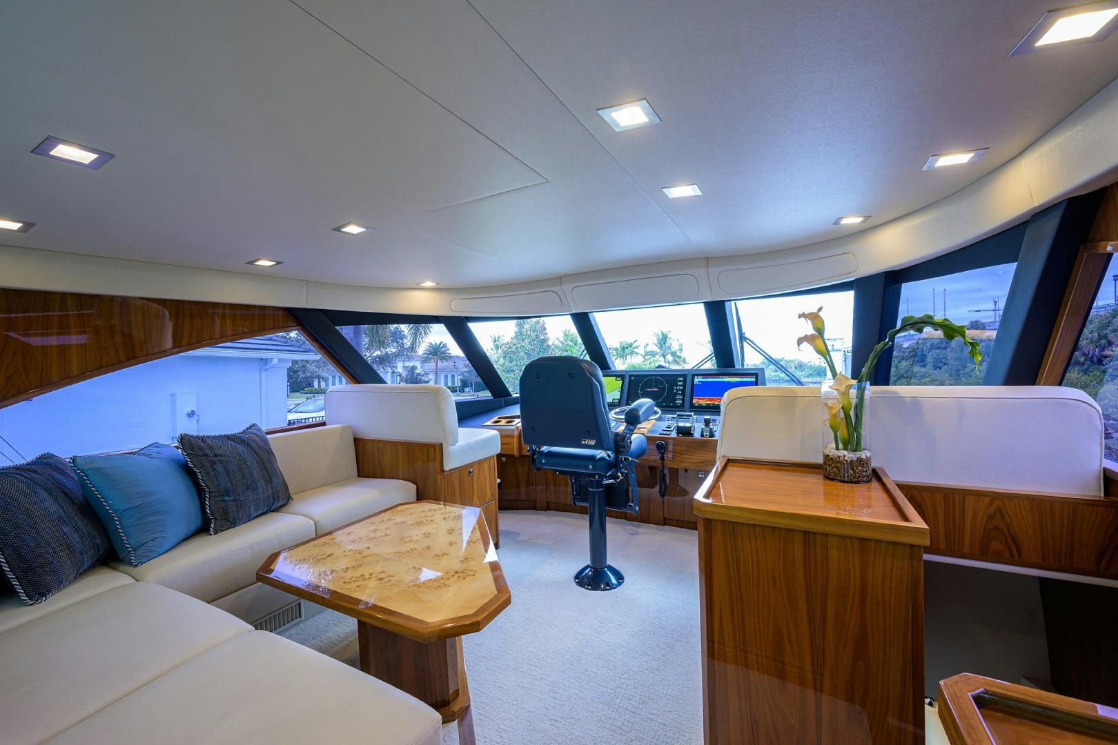 a room with a couch and a table and a chair aboard Renegade Yacht for Sale