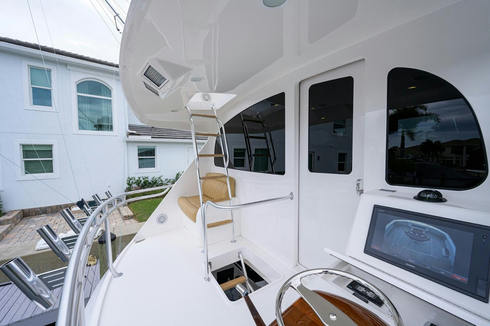 a white vehicle with a door open aboard Renegade Yacht for Sale
