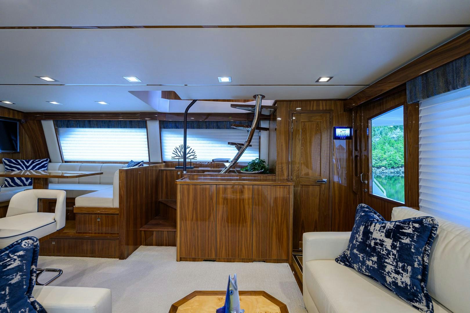 inside of a room with a wood wall and a large window aboard Renegade Yacht for Sale