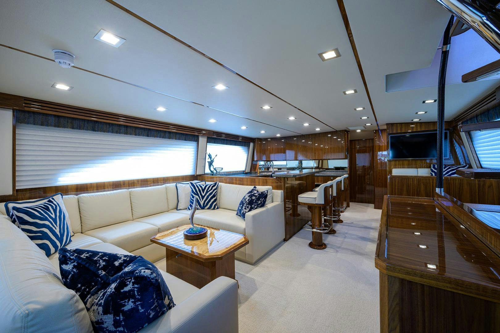 a living room with a couch and a table aboard Renegade Yacht for Sale