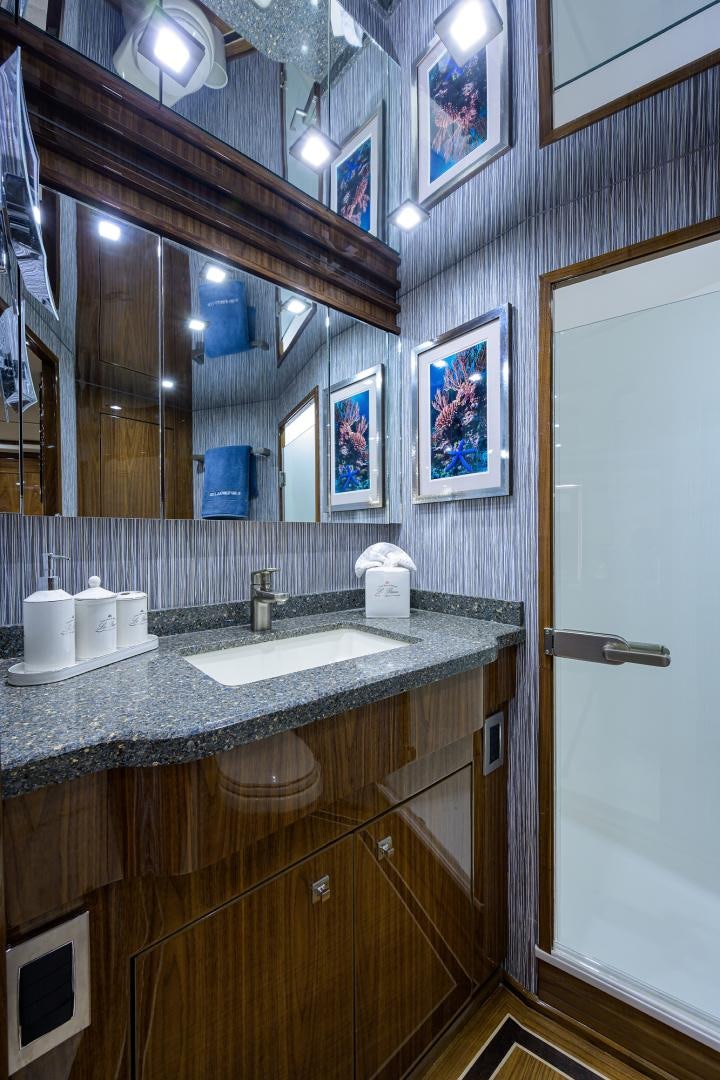 a bathroom with a large mirror aboard Renegade Yacht for Sale