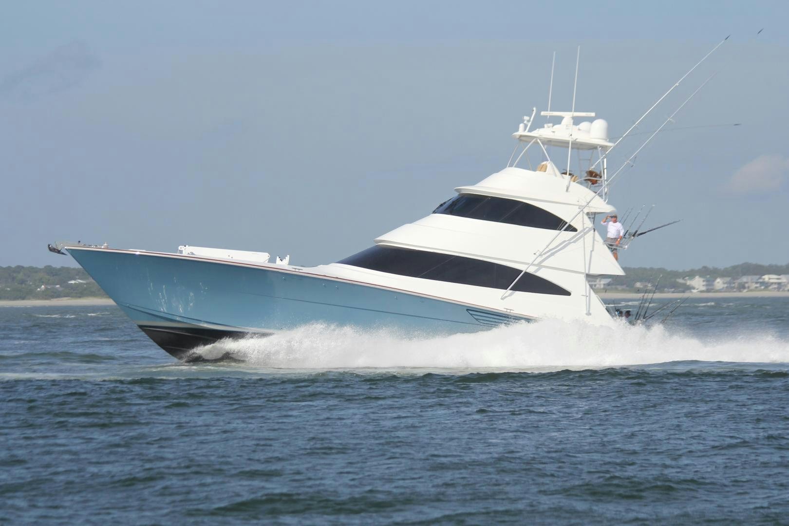 a white boat on the water aboard Renegade Yacht for Sale