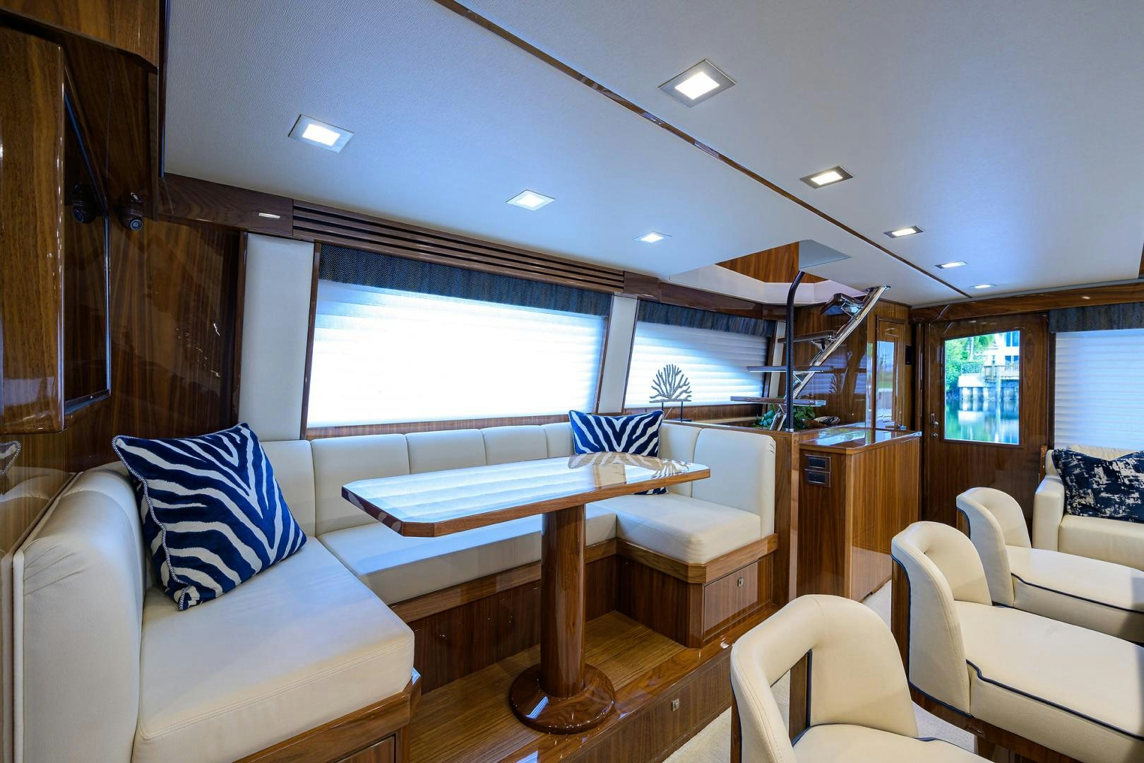 a room with a couch and a table and a window aboard Renegade Yacht for Sale