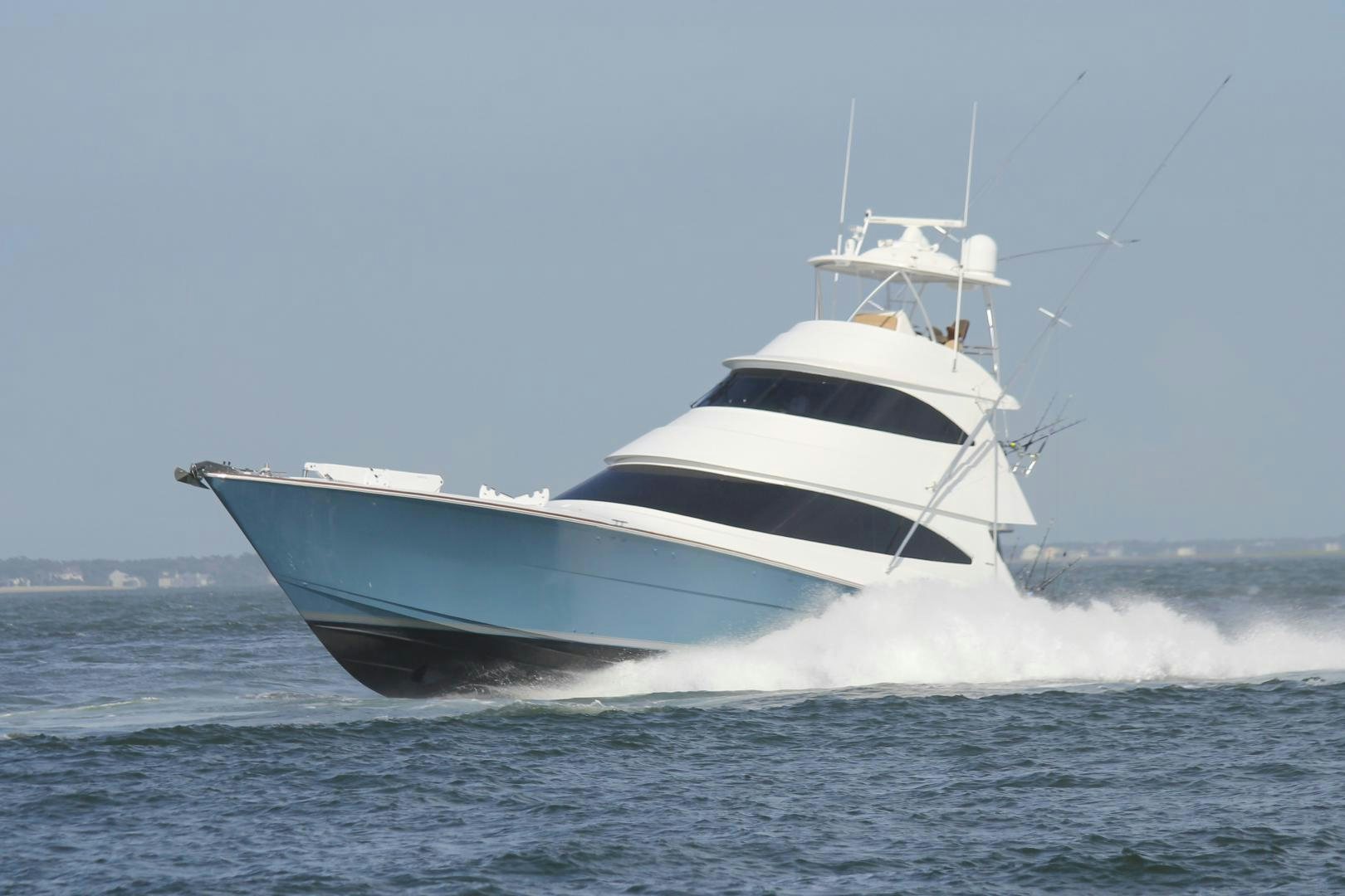 a large white boat in the water aboard Renegade Yacht for Sale