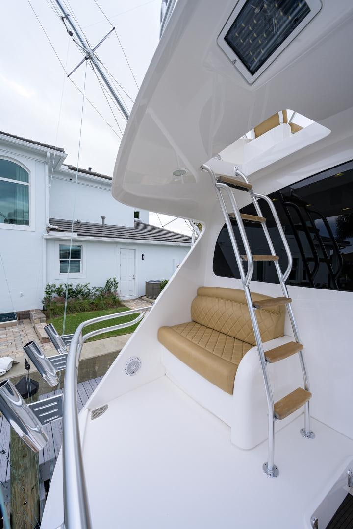 a white boat on a deck aboard Renegade Yacht for Sale