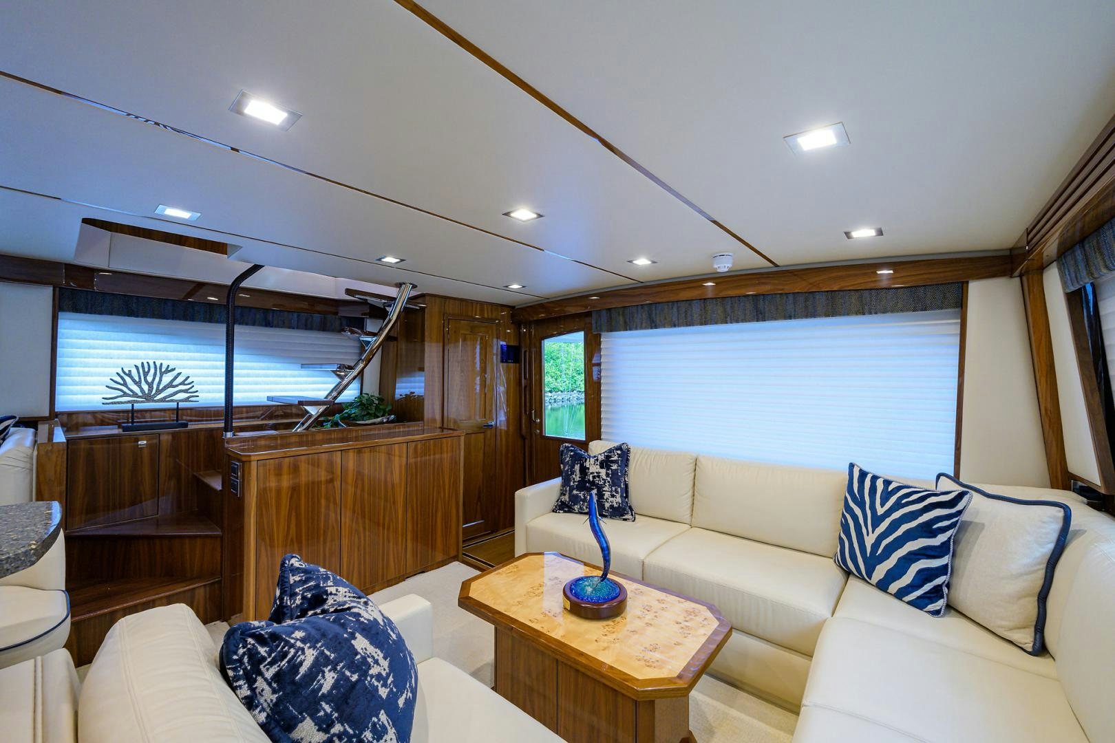 a living room with a large window aboard Renegade Yacht for Sale