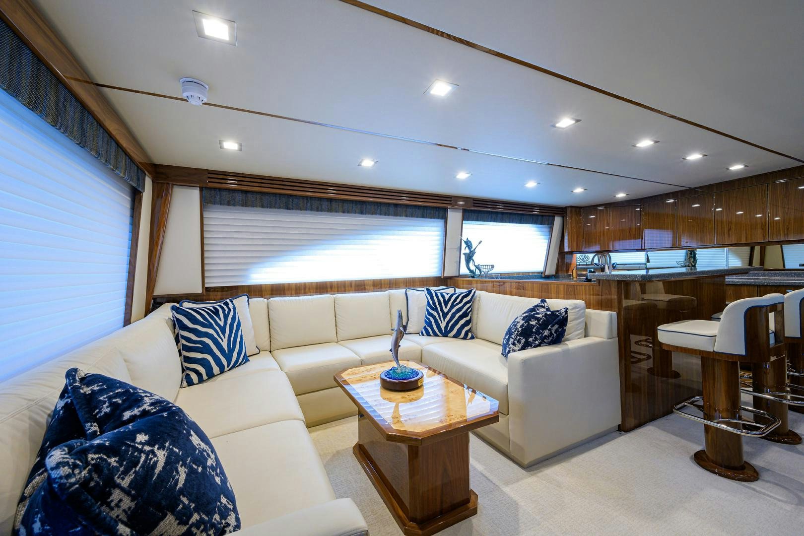 a living room with a couch and a table aboard Renegade Yacht for Sale