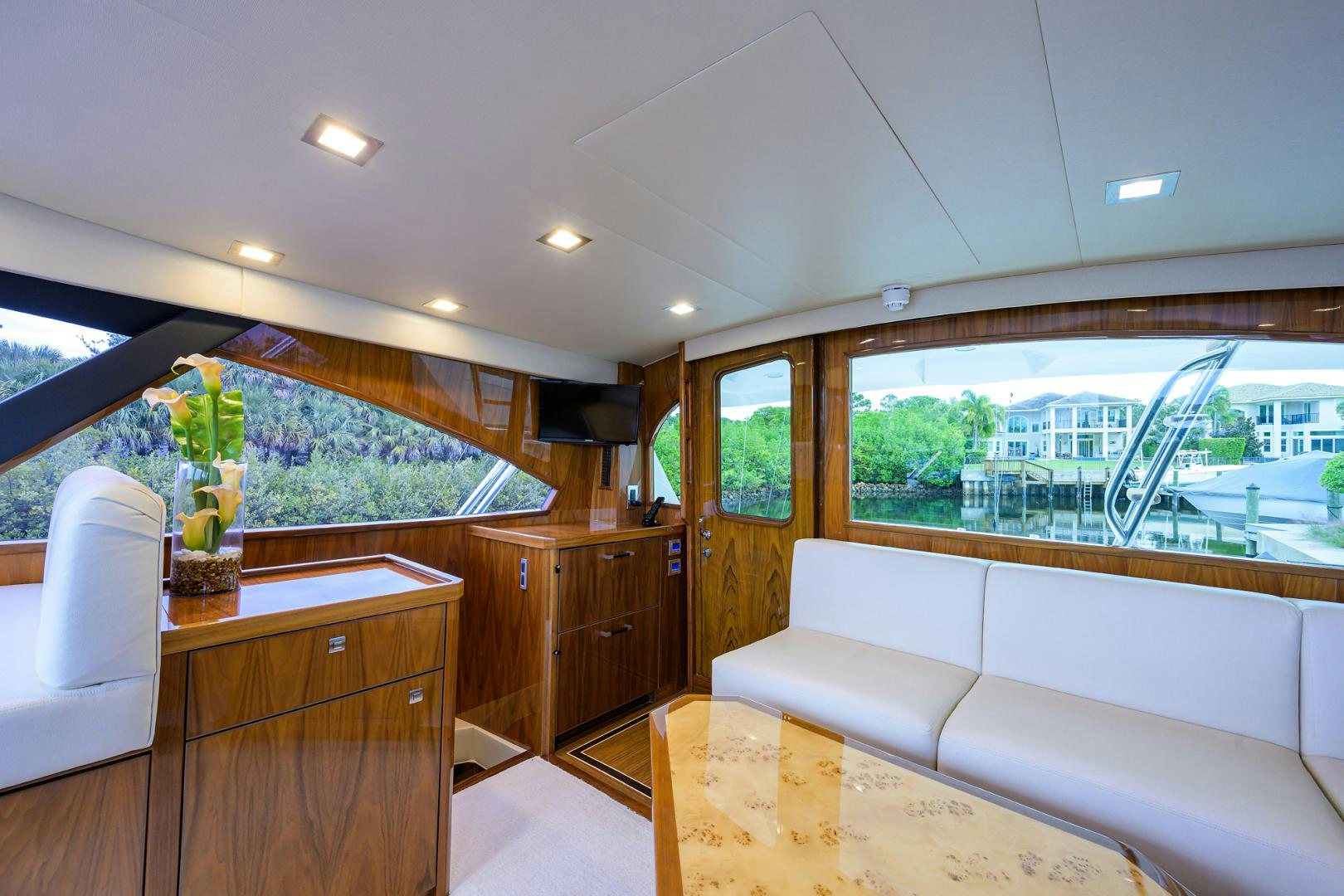 a living room with a large window aboard Renegade Yacht for Sale