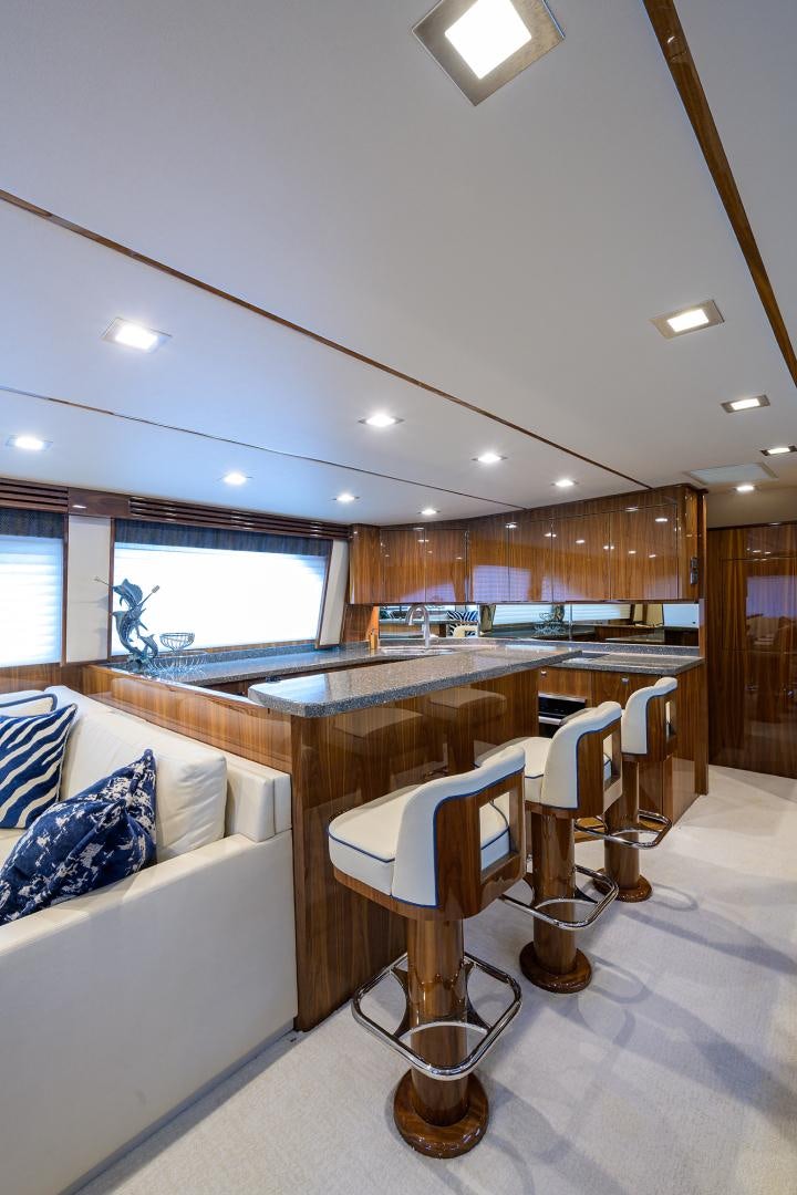 a room with a table and chairs aboard Renegade Yacht for Sale