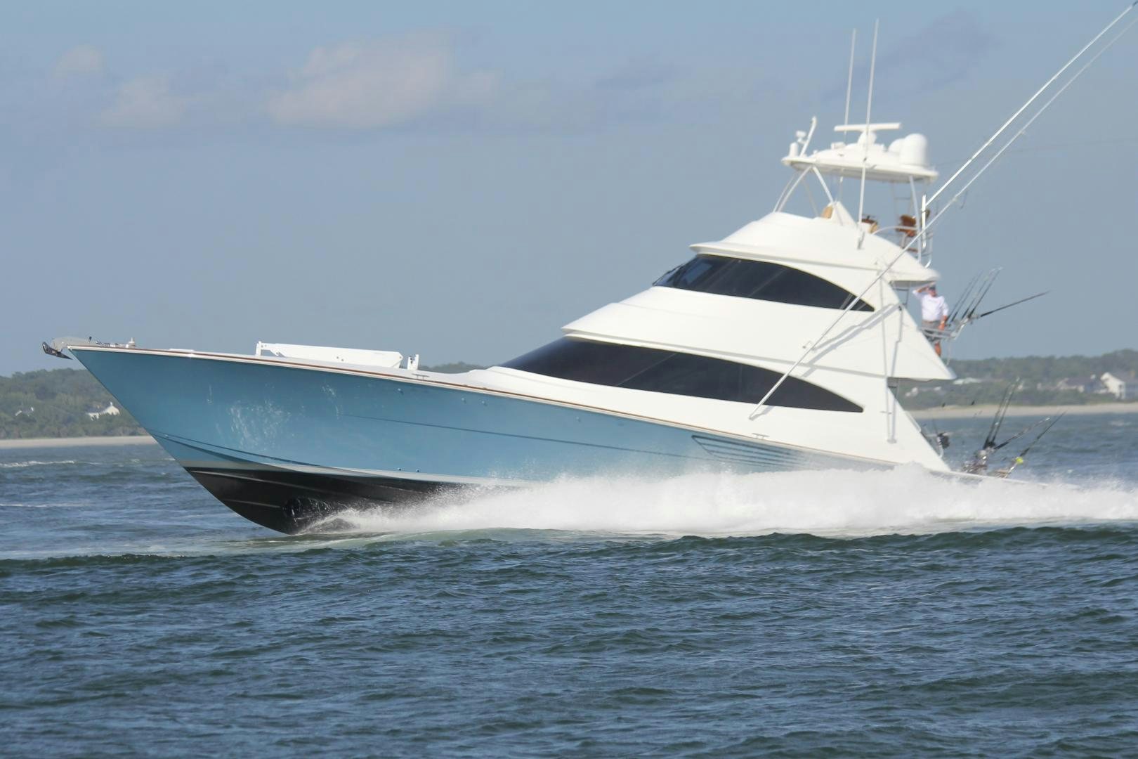 a white boat on the water aboard Renegade Yacht for Sale