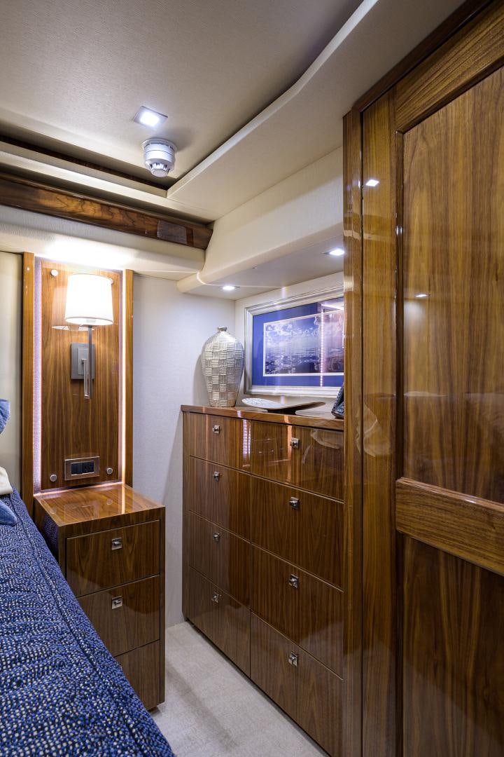 a room with a wood cabinet and a tv on the wall aboard Renegade Yacht for Sale