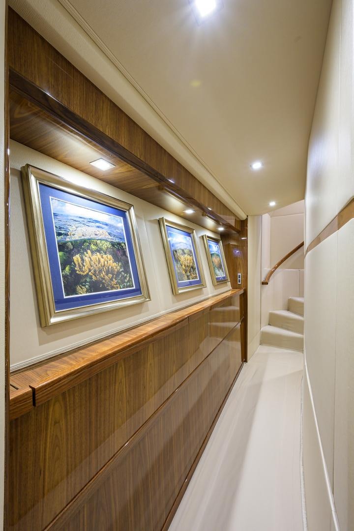 a hallway with a painting on the wall aboard Renegade Yacht for Sale
