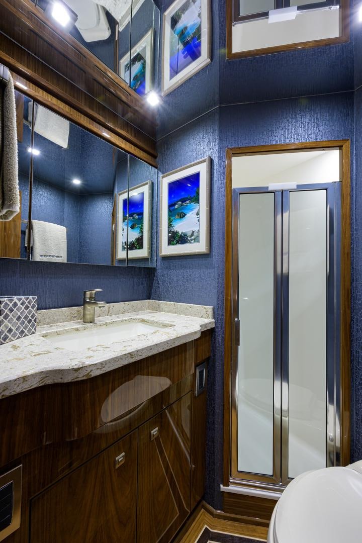 a bathroom with a sink and a mirror aboard Renegade Yacht for Sale
