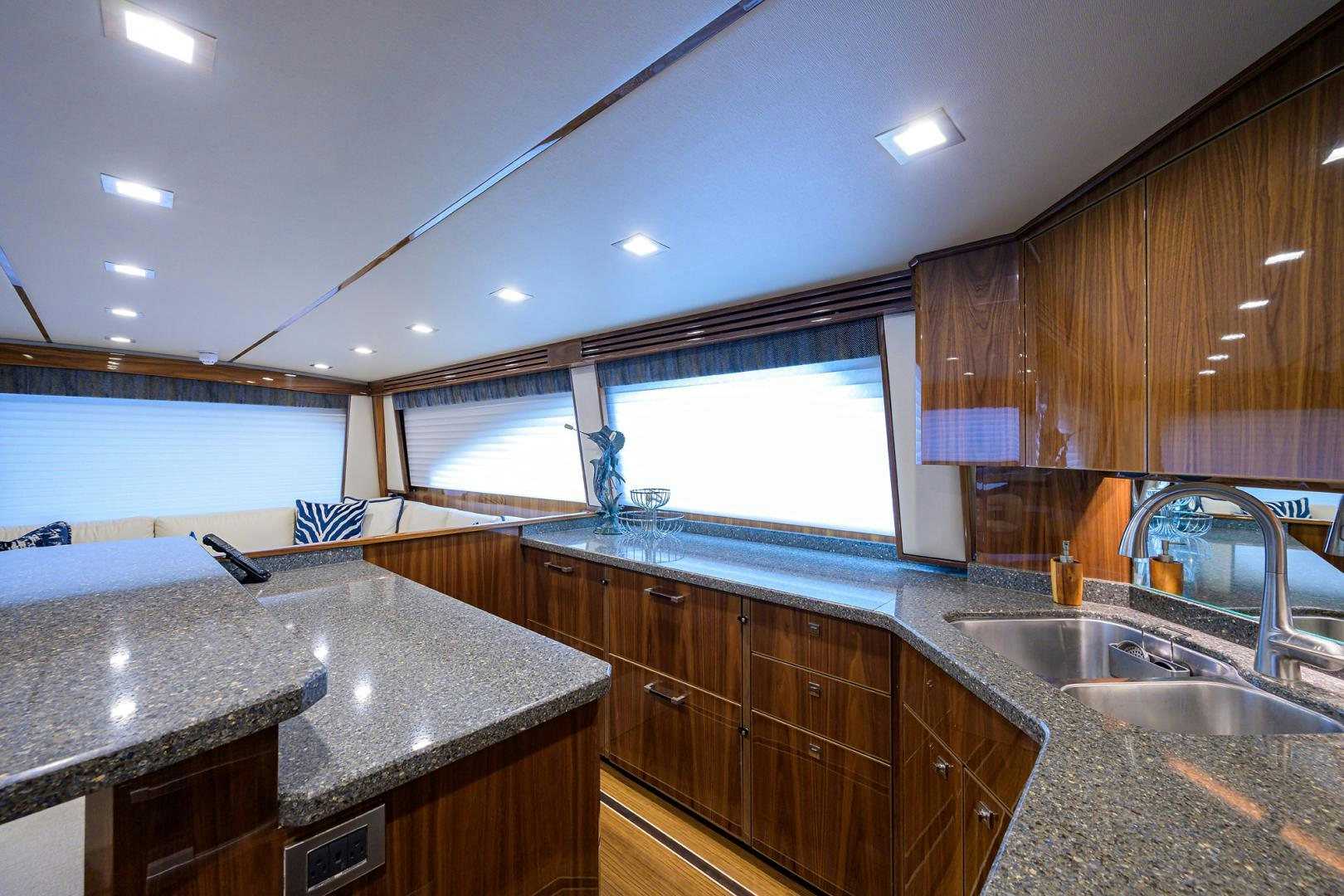a kitchen with wooden cabinets aboard Renegade Yacht for Sale