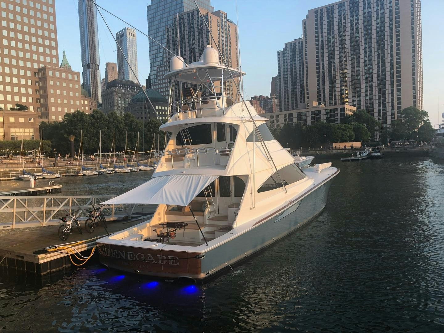 a boat docked at a pier aboard Renegade Yacht for Sale