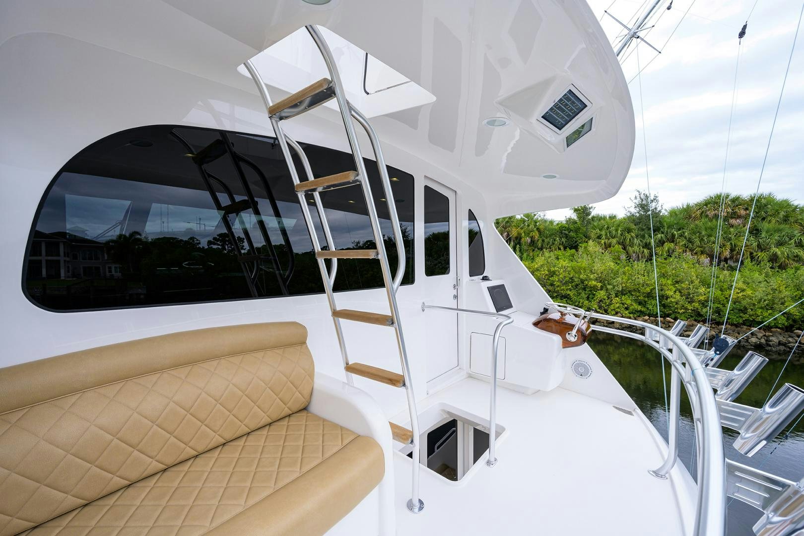 a white boat with a ladder aboard Renegade Yacht for Sale