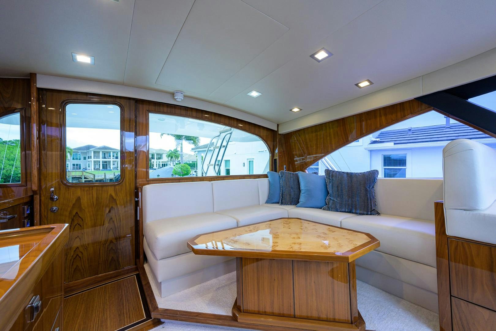 a living room with a couch and a table aboard Renegade Yacht for Sale