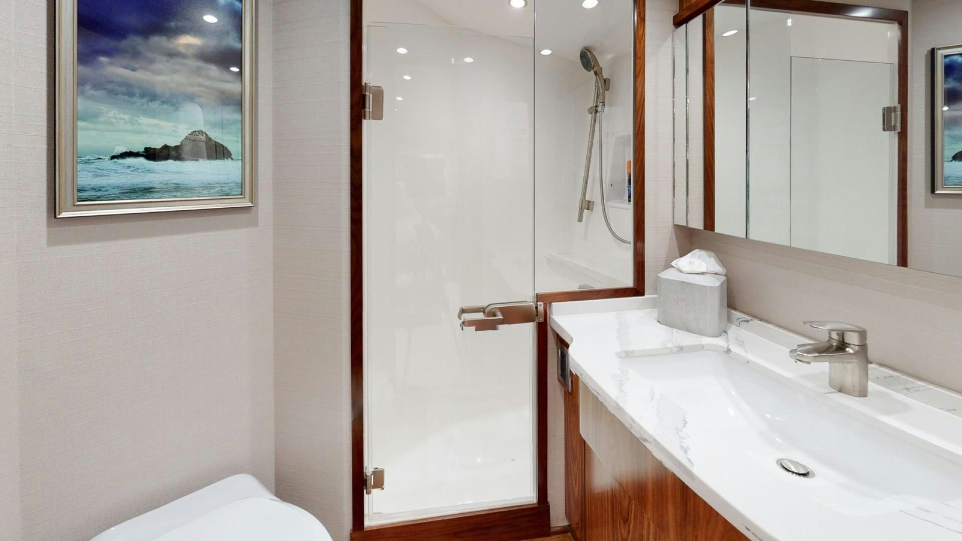 a bathroom with a sink and mirror aboard WONDER Yacht for Sale