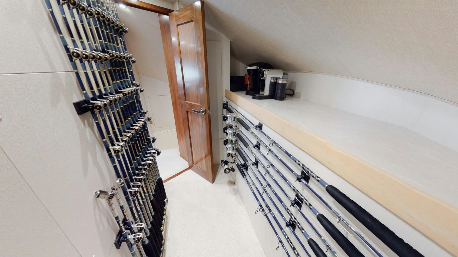 a room with a ladder and a machine on the wall aboard WONDER Yacht for Sale