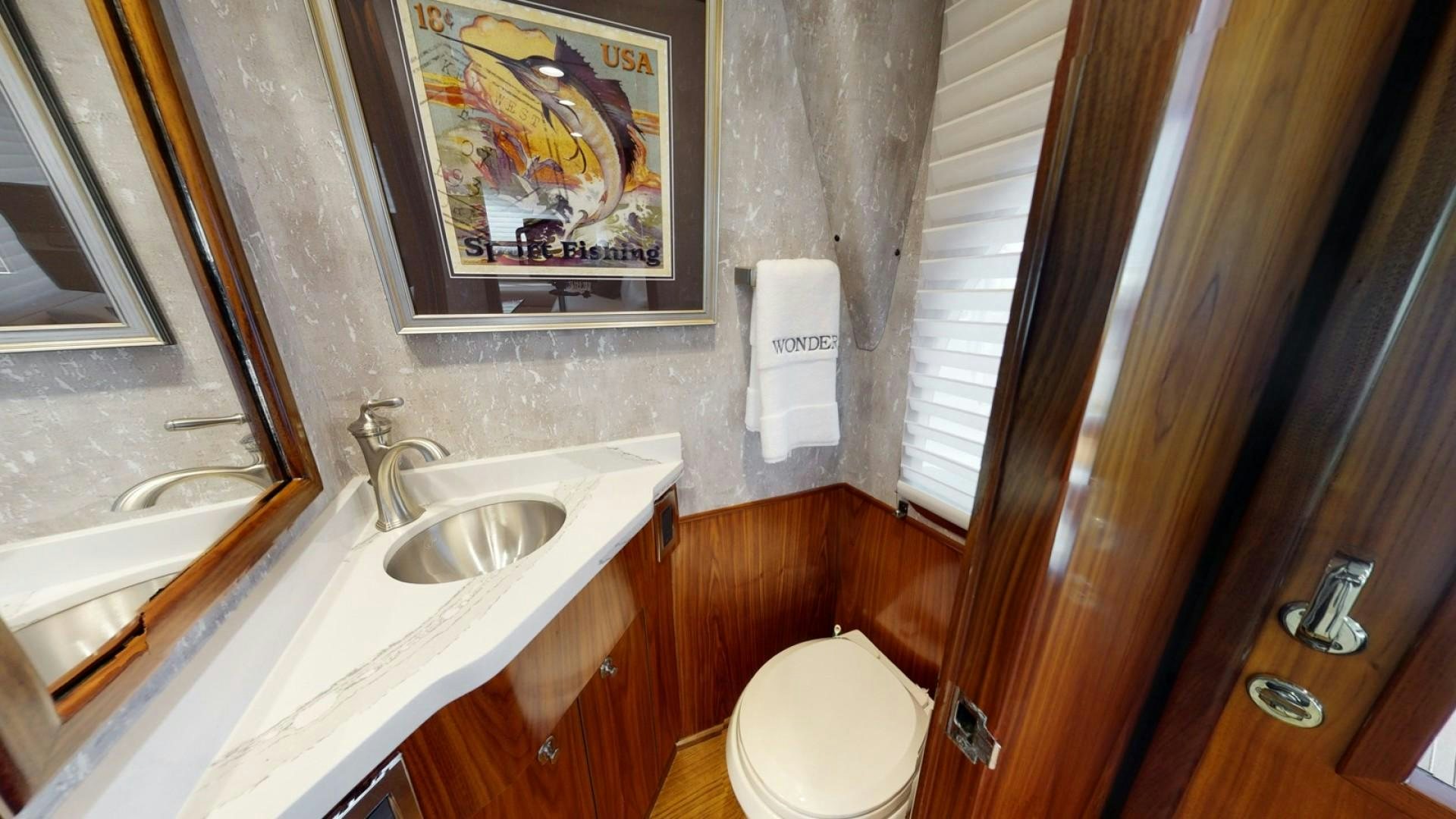 a bathroom with a toilet and sink aboard WONDER Yacht for Sale