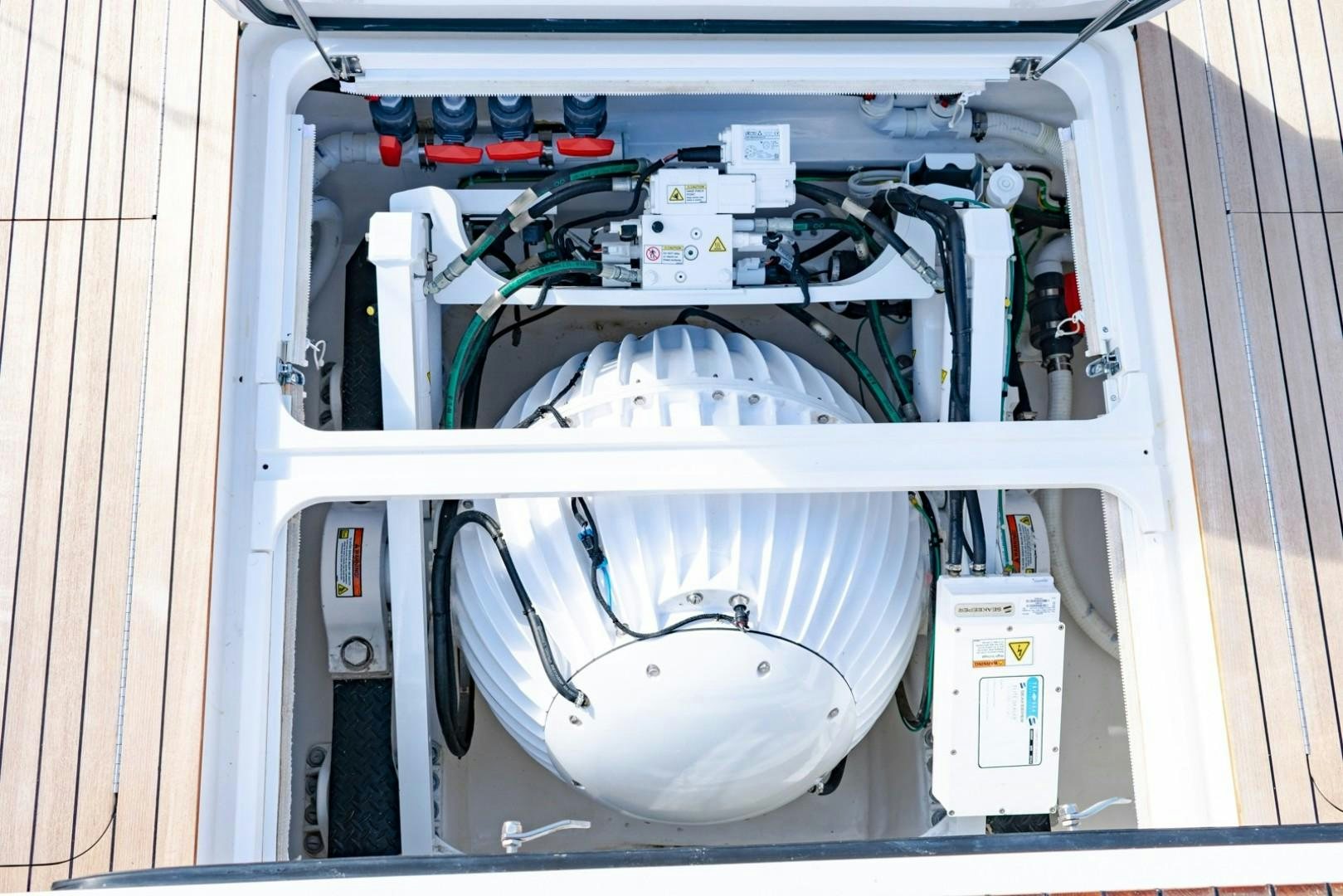 a white machine with a white cylinder aboard WONDER Yacht for Sale