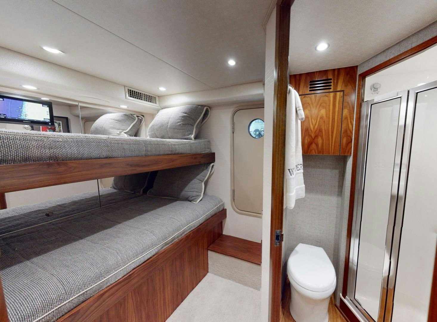 a room with a bed and a desk aboard WONDER Yacht for Sale