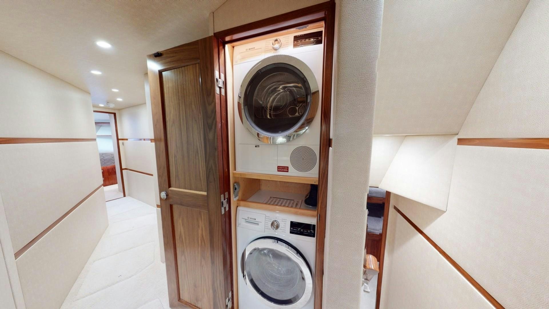 a washer and dryer in a room aboard WONDER Yacht for Sale