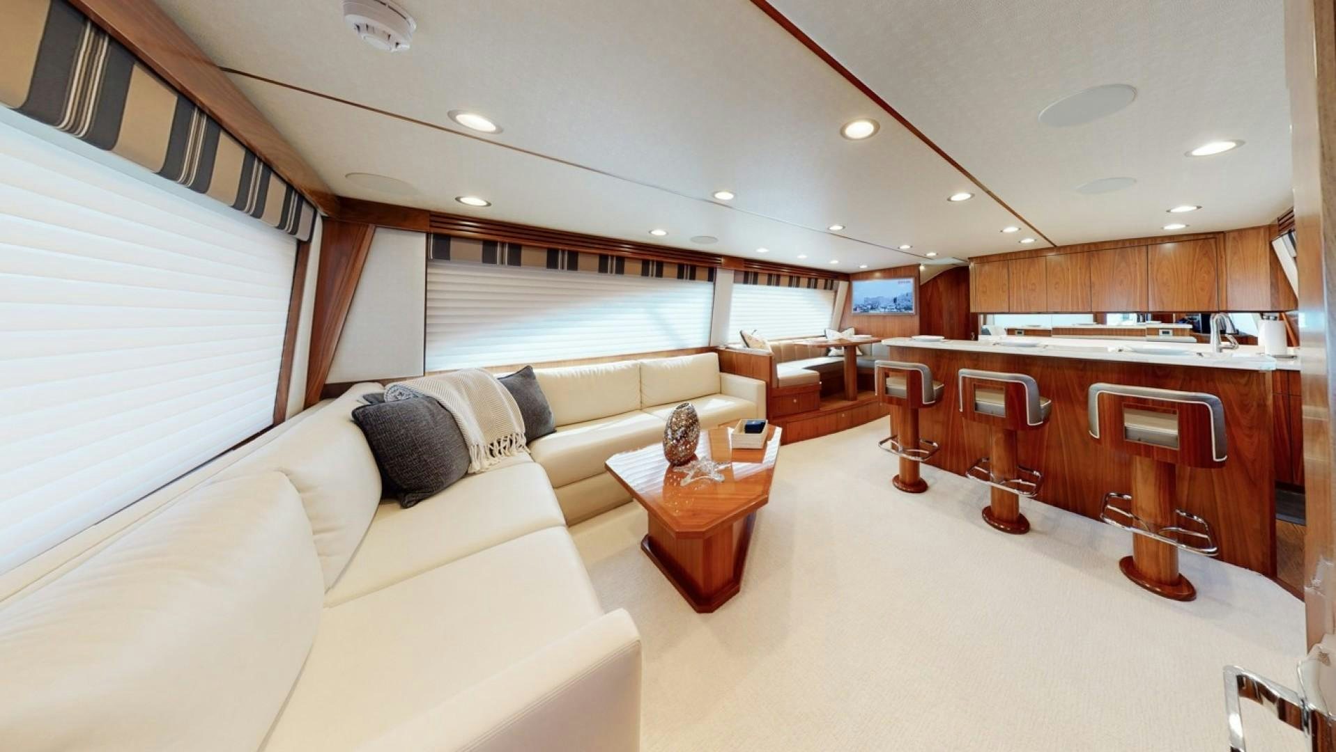 a living room with a couch and a table aboard WONDER Yacht for Sale