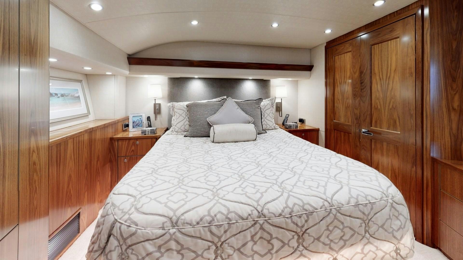 a bed with white sheets aboard WONDER Yacht for Sale