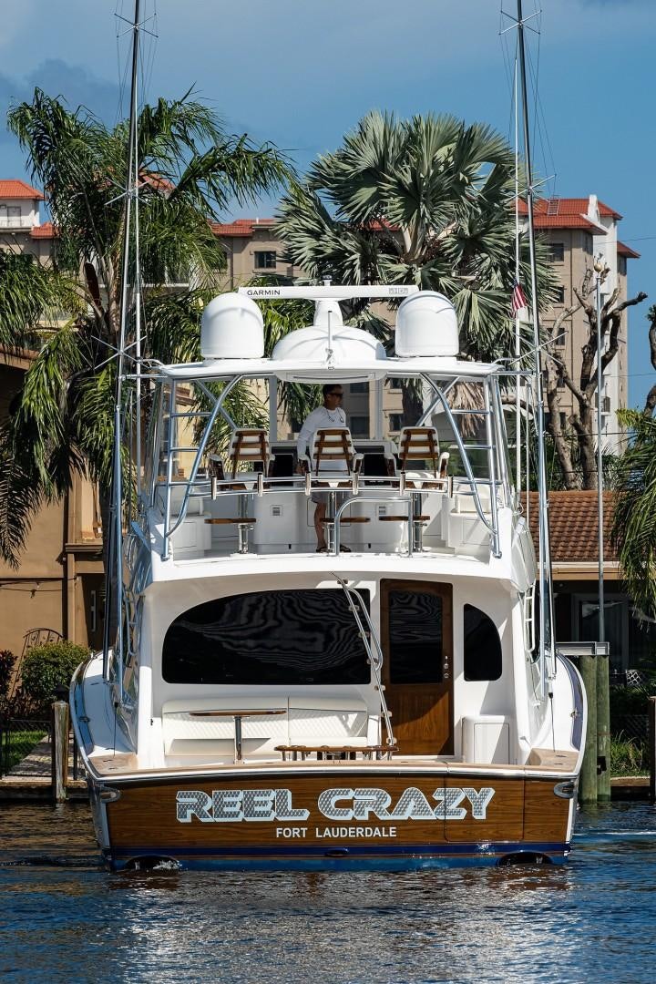 a boat with a person on the deck aboard REEL CRAZY Yacht for Sale