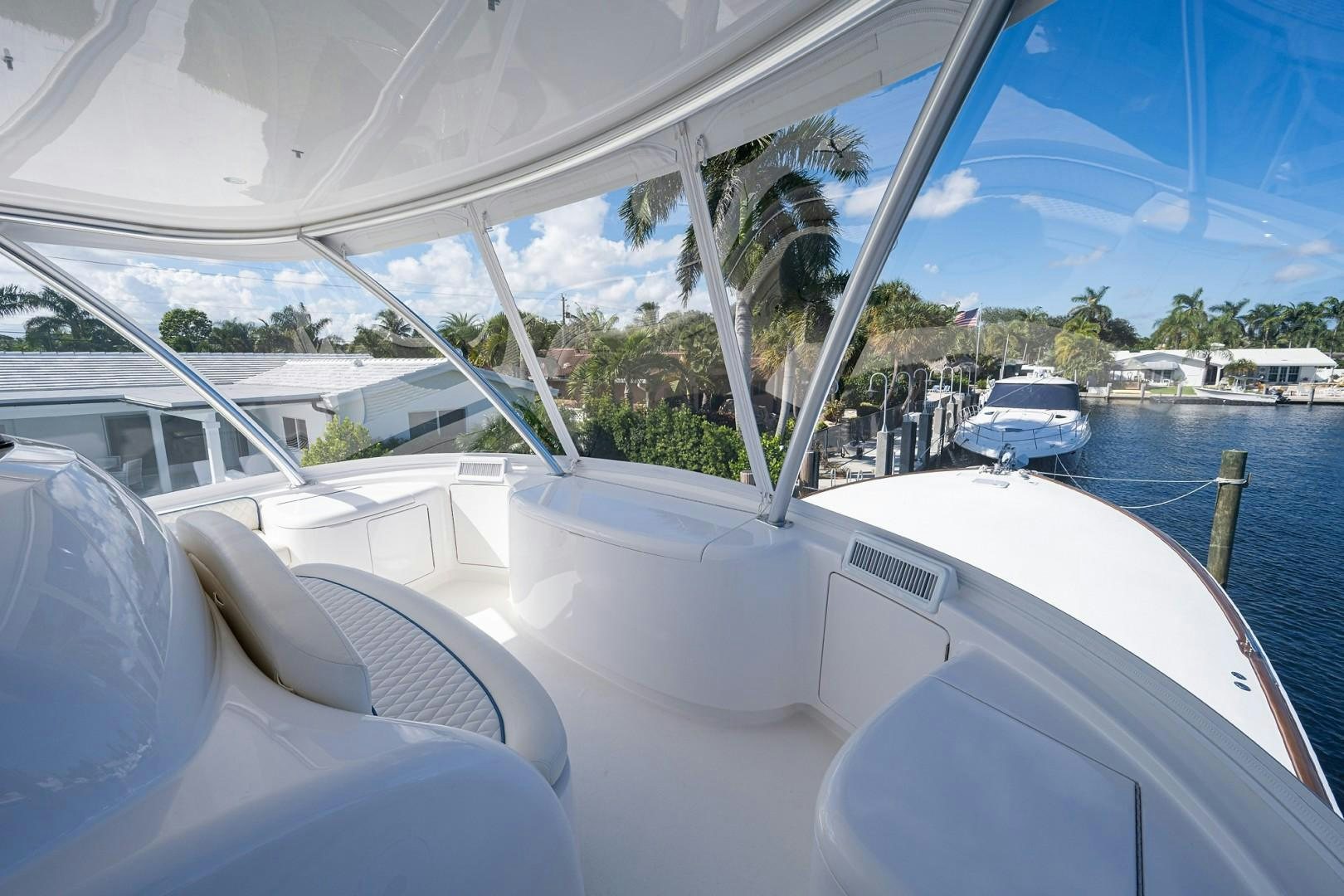 a boat with a large body of water and trees in the background aboard REEL CRAZY Yacht for Sale