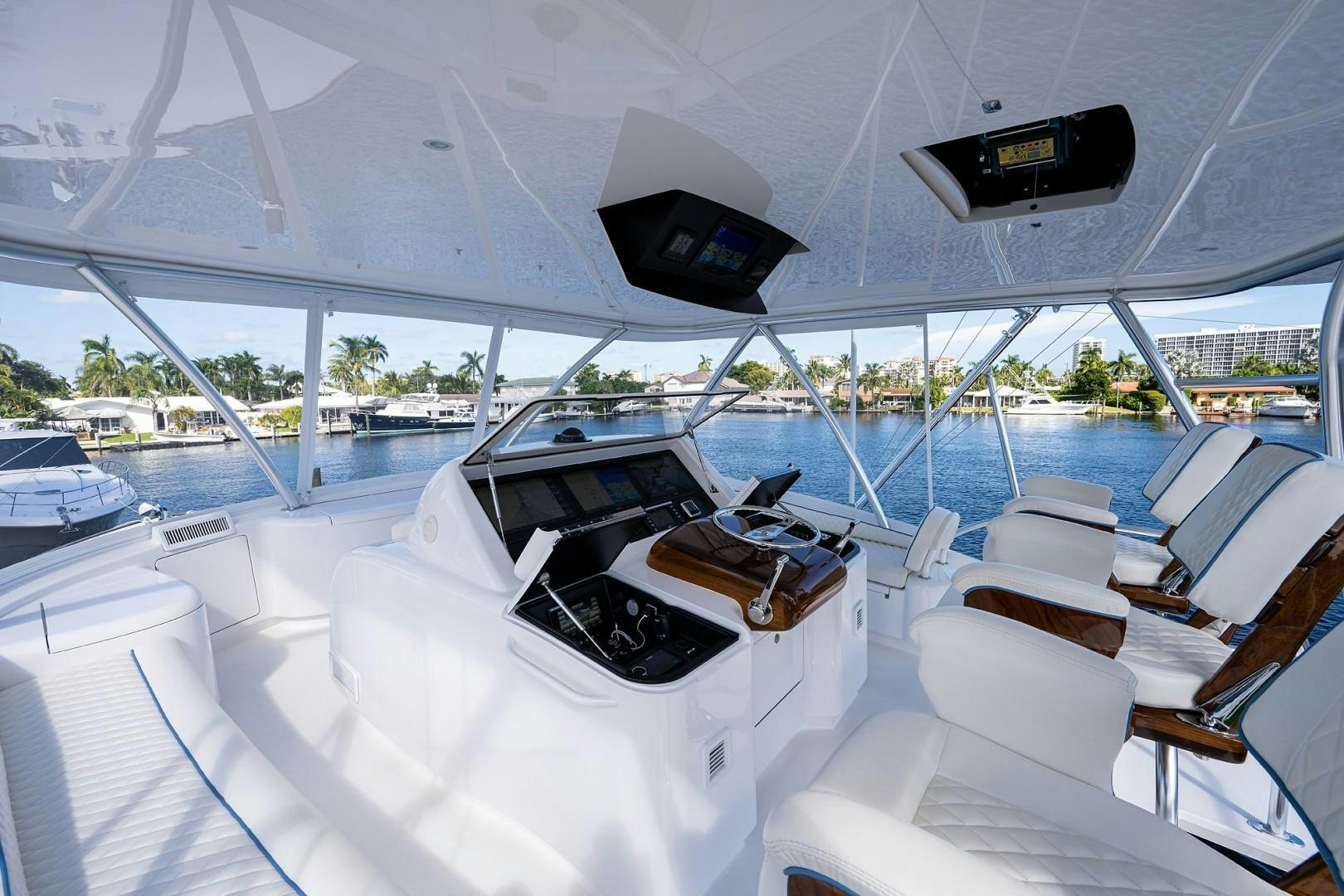 a yacht with a steering wheel aboard REEL CRAZY Yacht for Sale