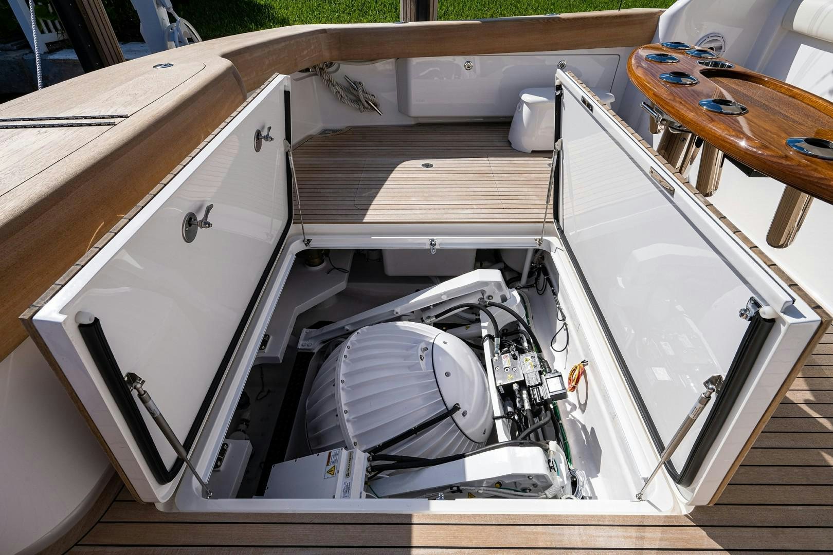 a car with its doors open aboard REEL CRAZY Yacht for Sale