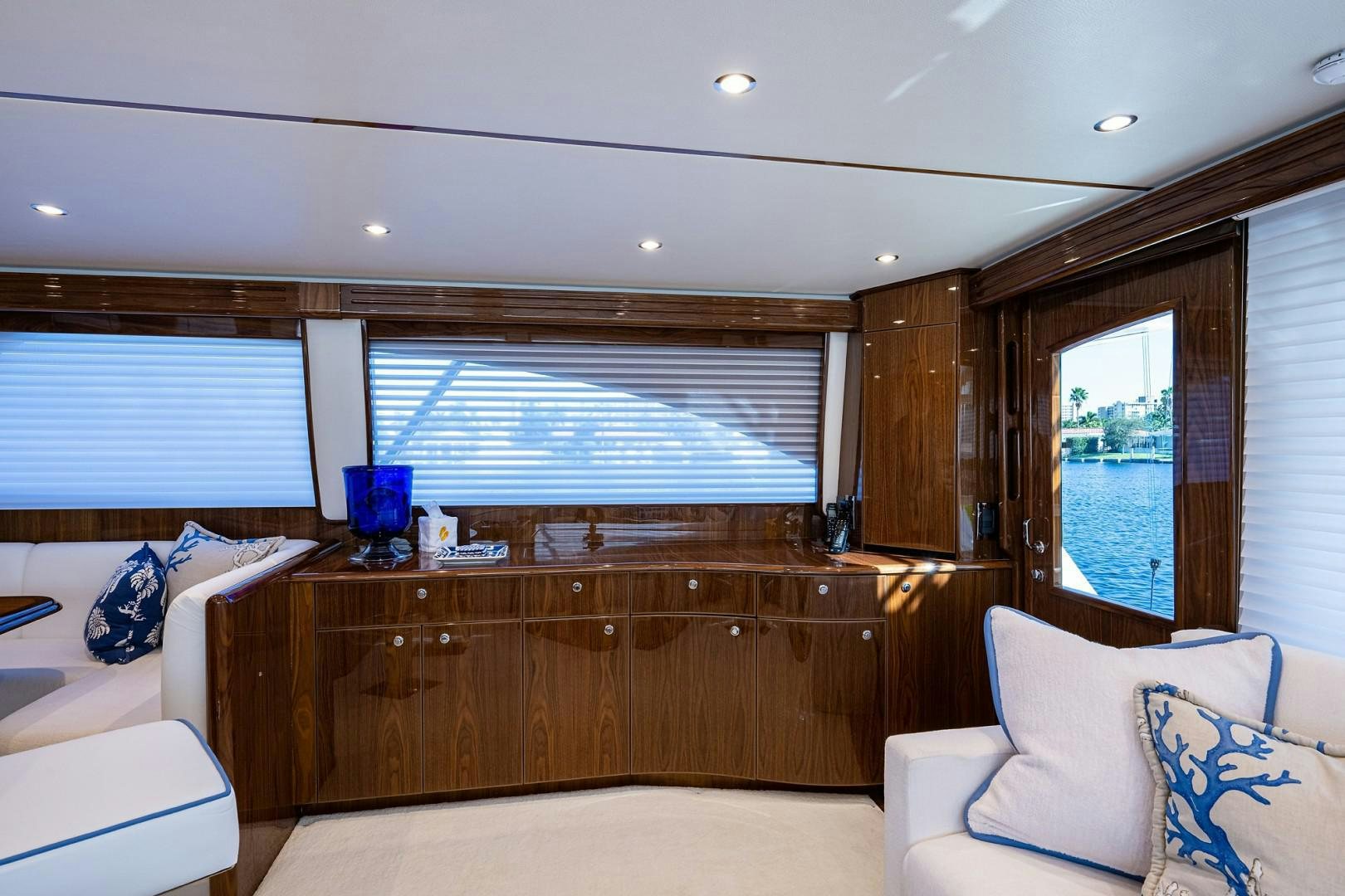 a living room with a large window aboard REEL CRAZY Yacht for Sale