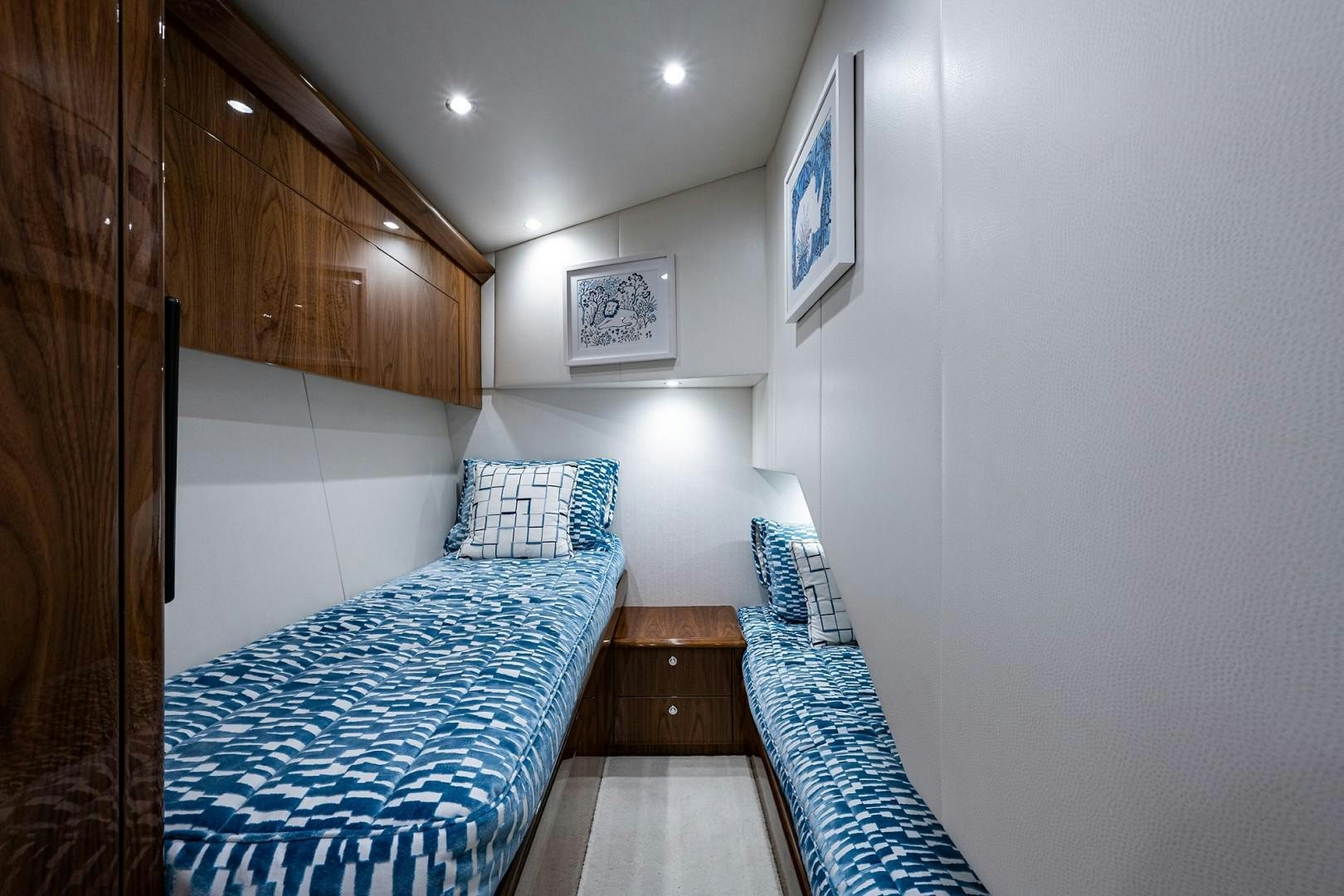 a room with a bed and a wood door aboard REEL CRAZY Yacht for Sale