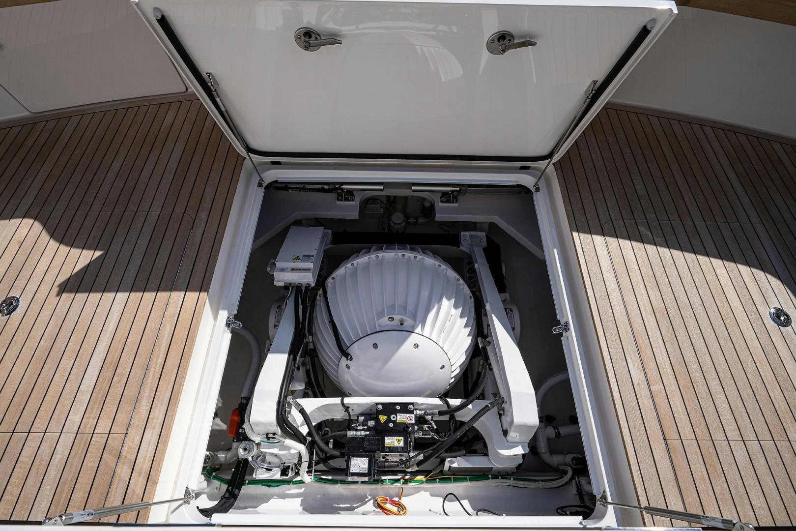 a white car with a black hood aboard REEL CRAZY Yacht for Sale