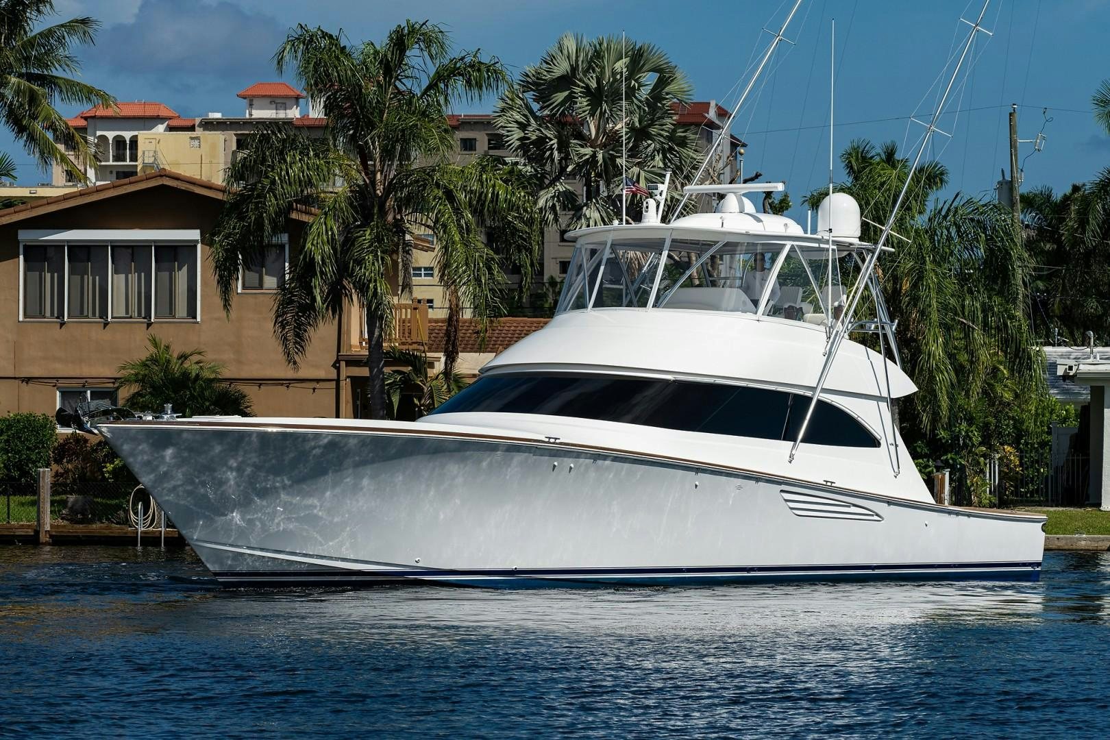 a white boat in a body of water aboard REEL CRAZY Yacht for Sale