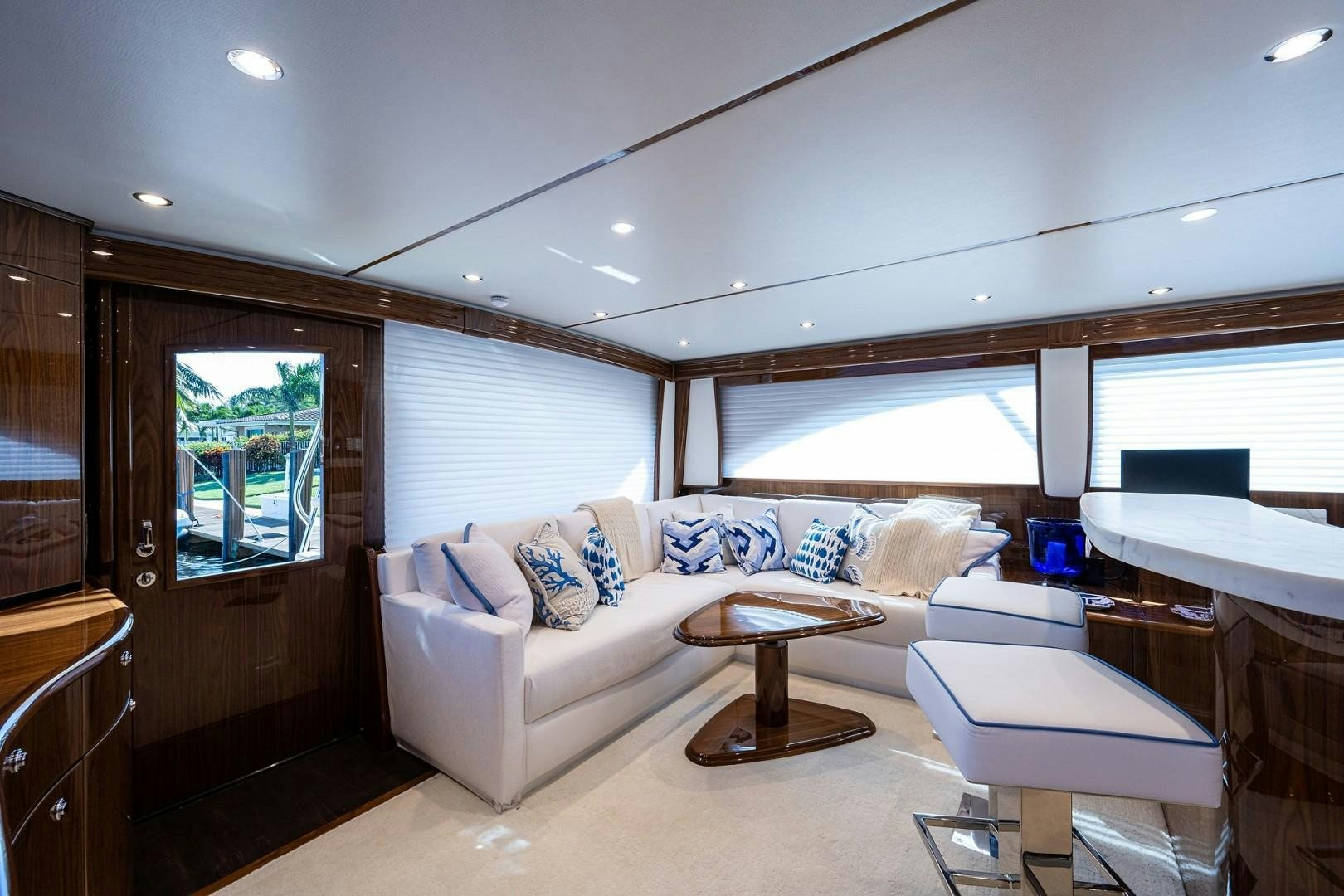 a living room with a couch and a table aboard REEL CRAZY Yacht for Sale