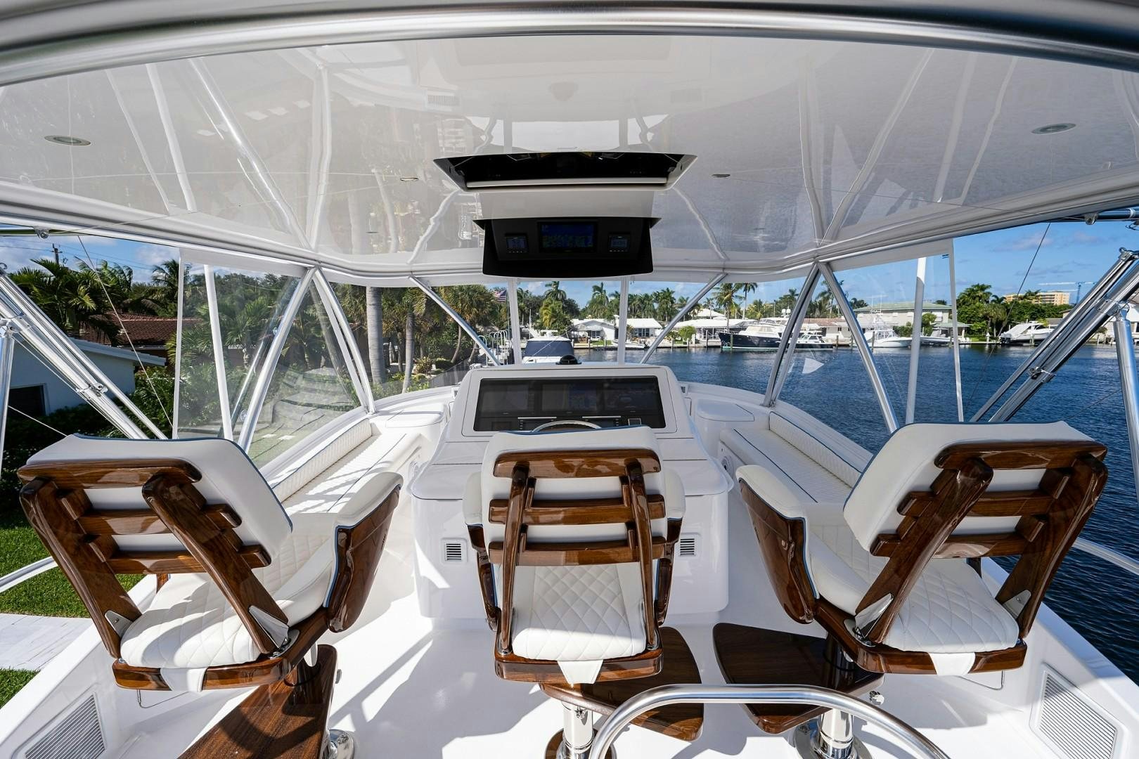 a boat with chairs on it aboard REEL CRAZY Yacht for Sale