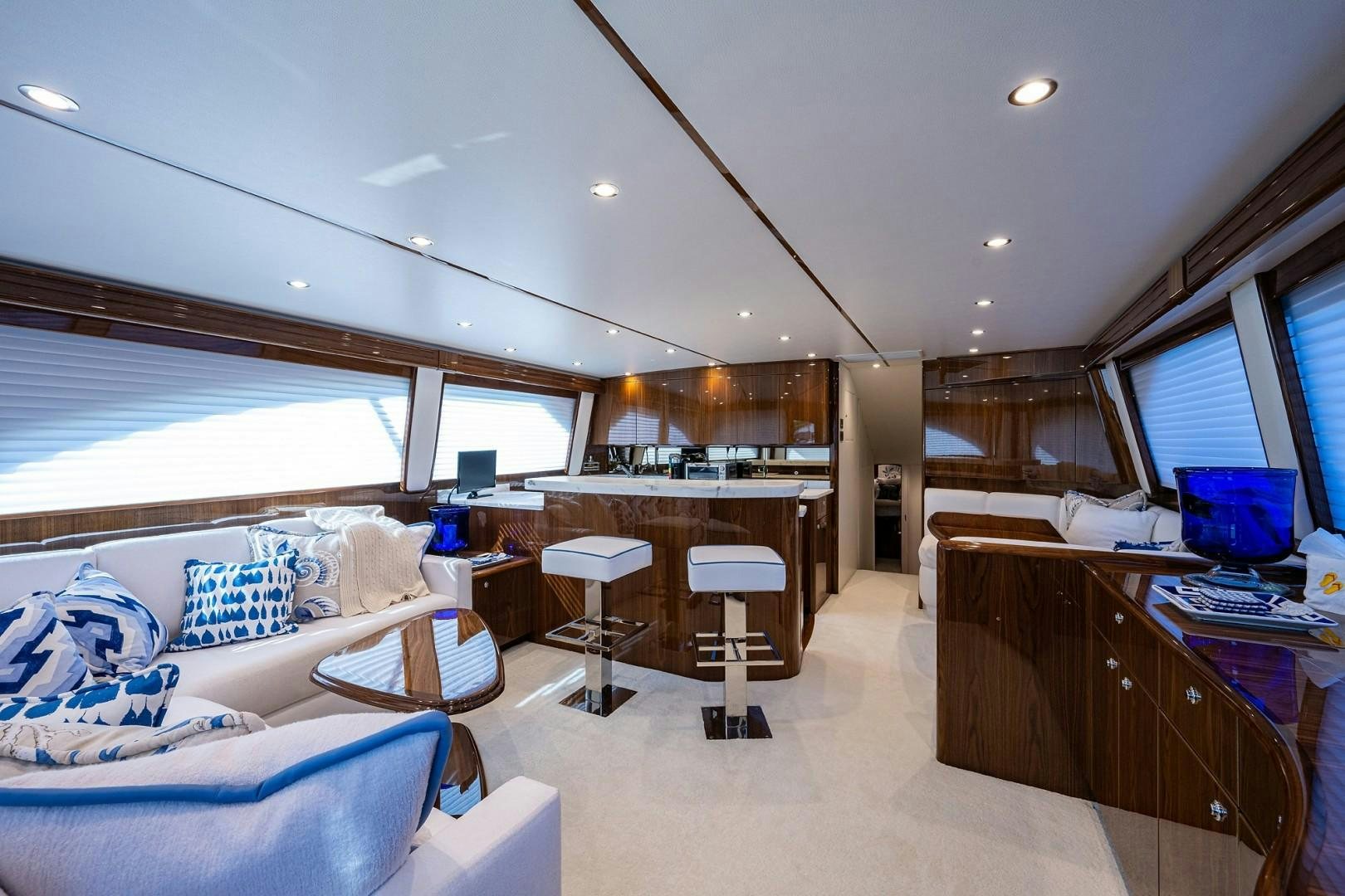 a room with a bed and desk aboard REEL CRAZY Yacht for Sale