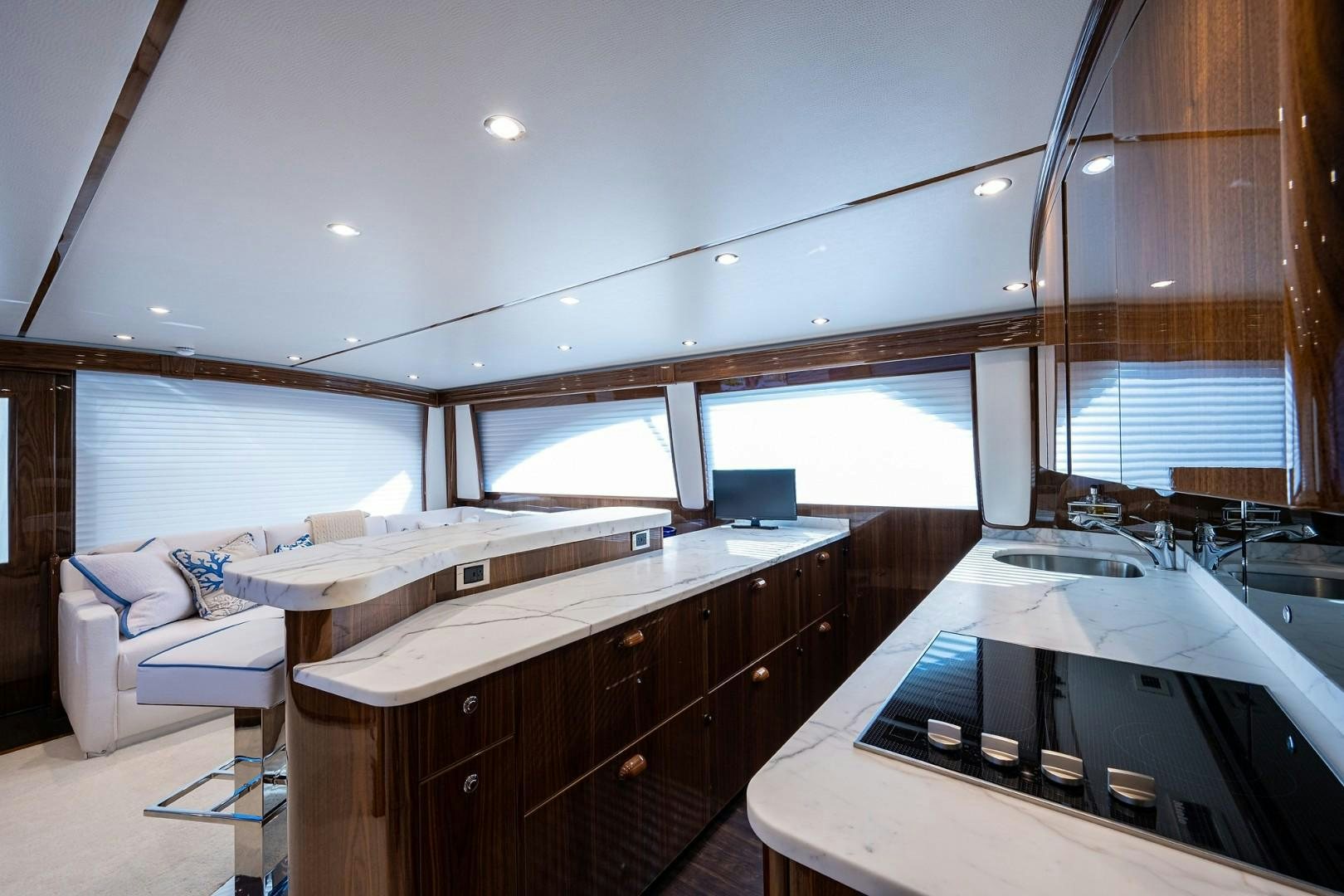 a room with a bed and a desk aboard REEL CRAZY Yacht for Sale