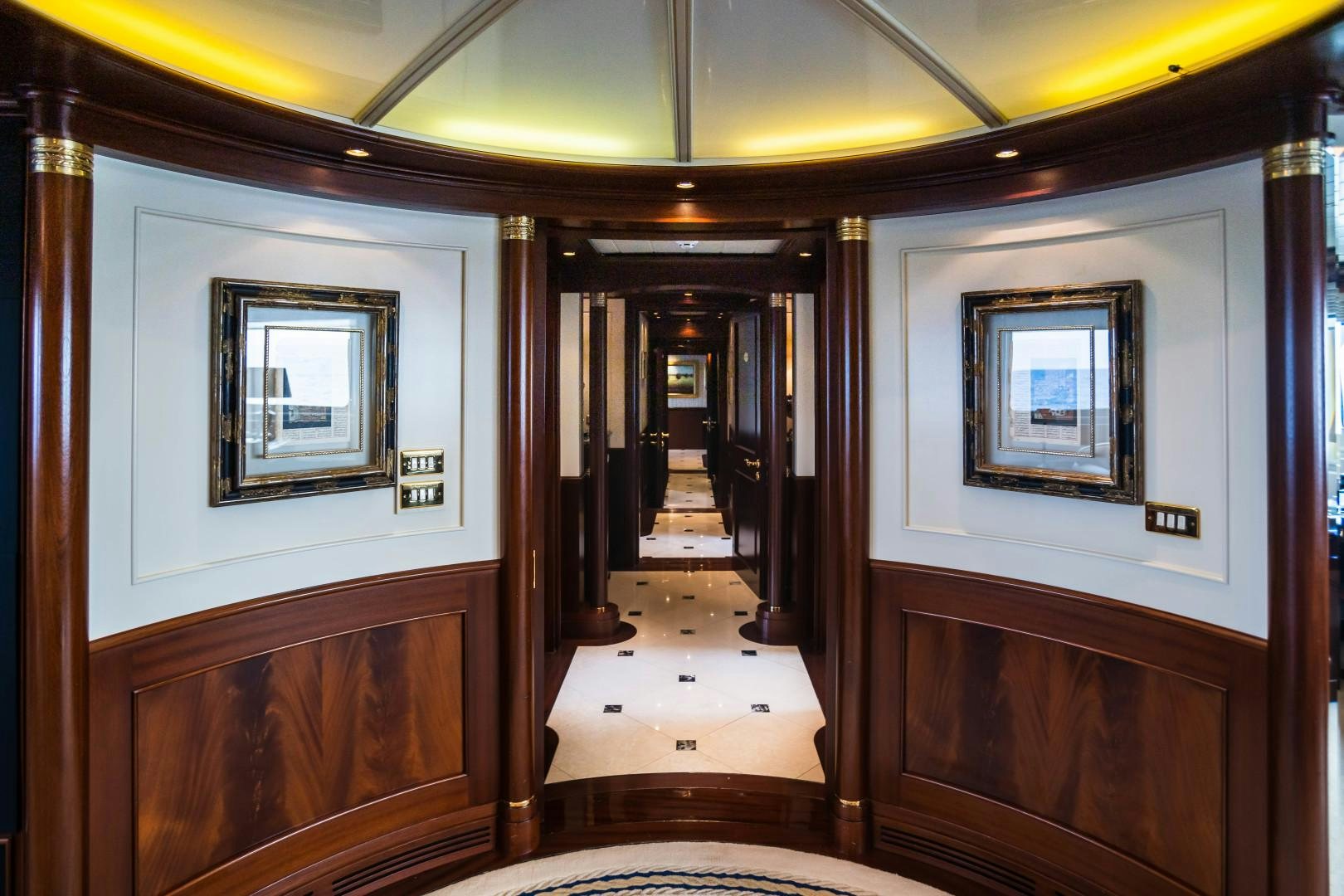 a hallway with wood doors aboard FARIBANA V Yacht for Sale