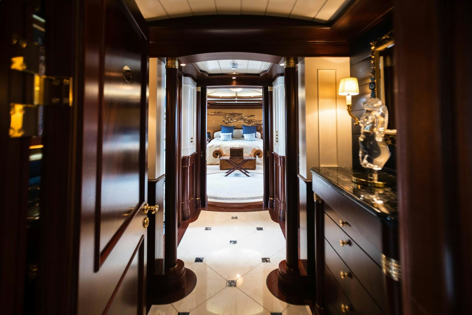 a hallway with a mirror and cabinets aboard FARIBANA V Yacht for Sale