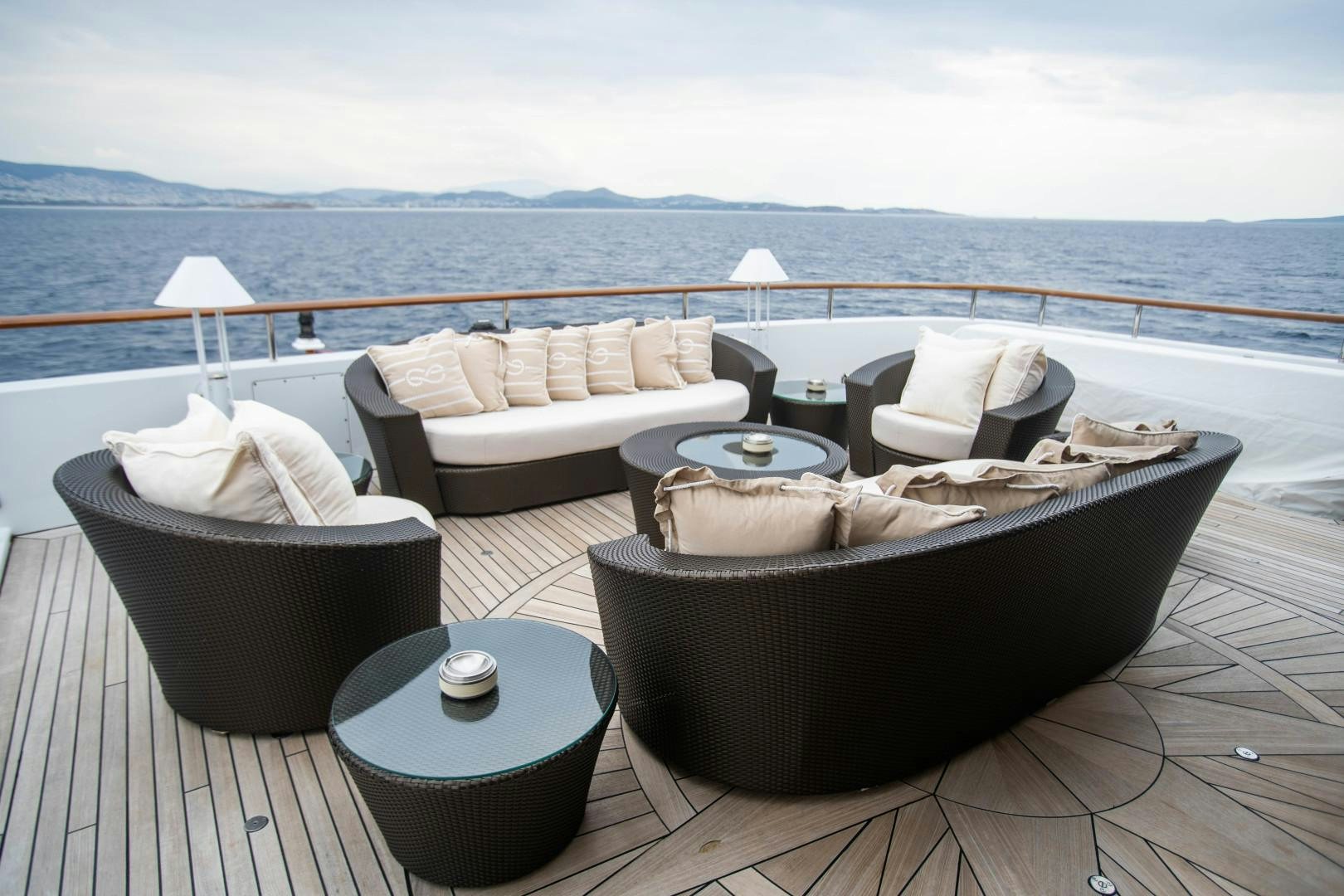 a large patio with a large table and chairs on it aboard FARIBANA V Yacht for Sale