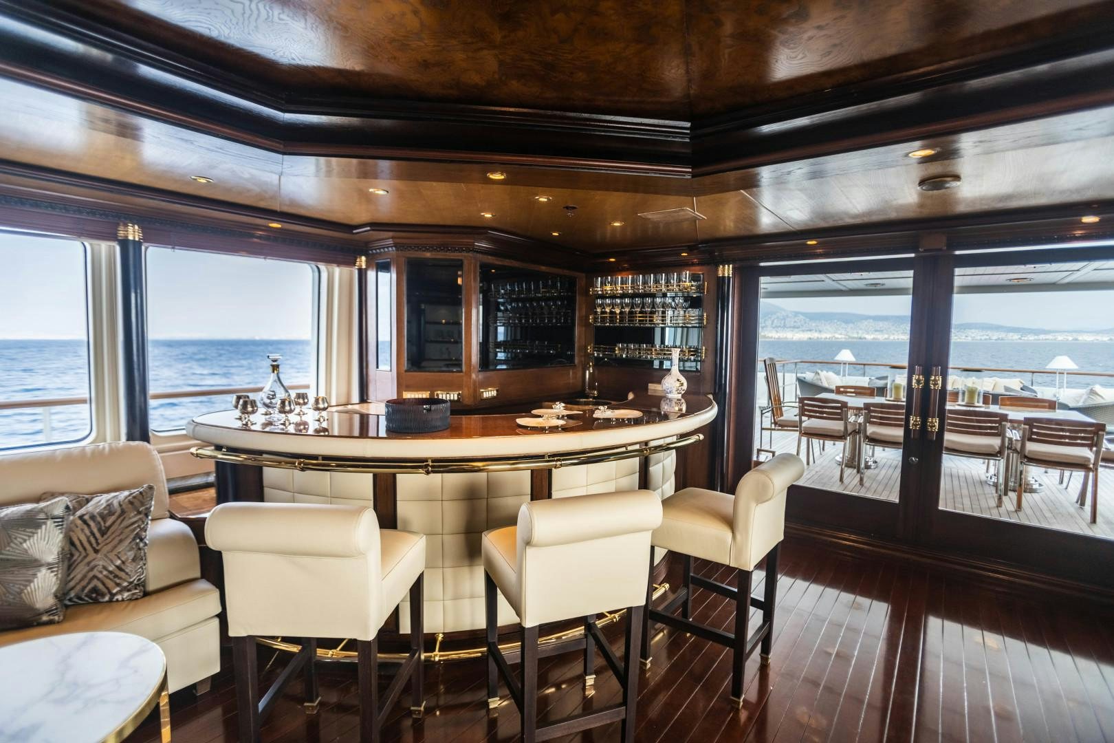a large dining table in a room aboard FARIBANA V Yacht for Sale