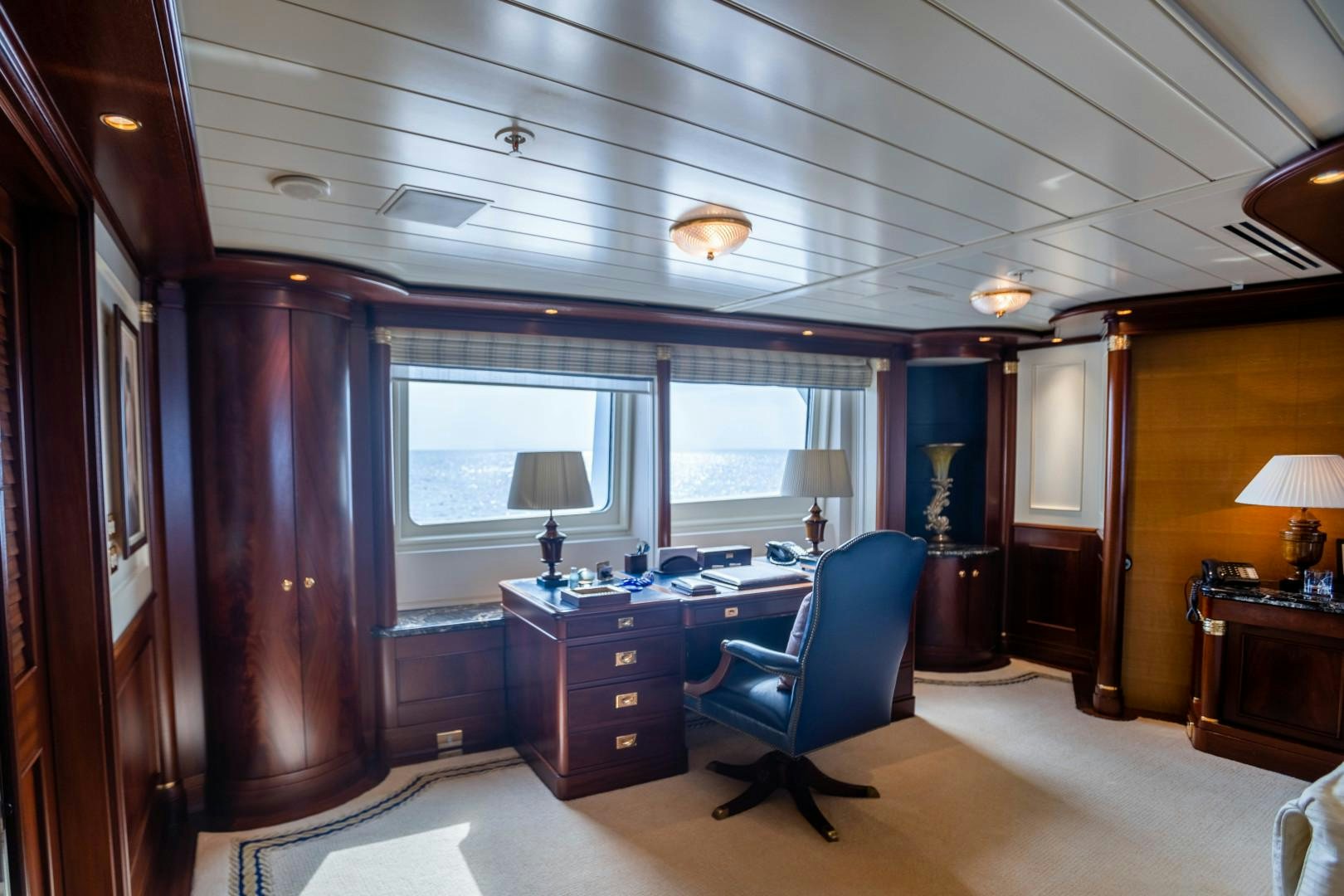 a room with a desk and a window aboard FARIBANA V Yacht for Sale